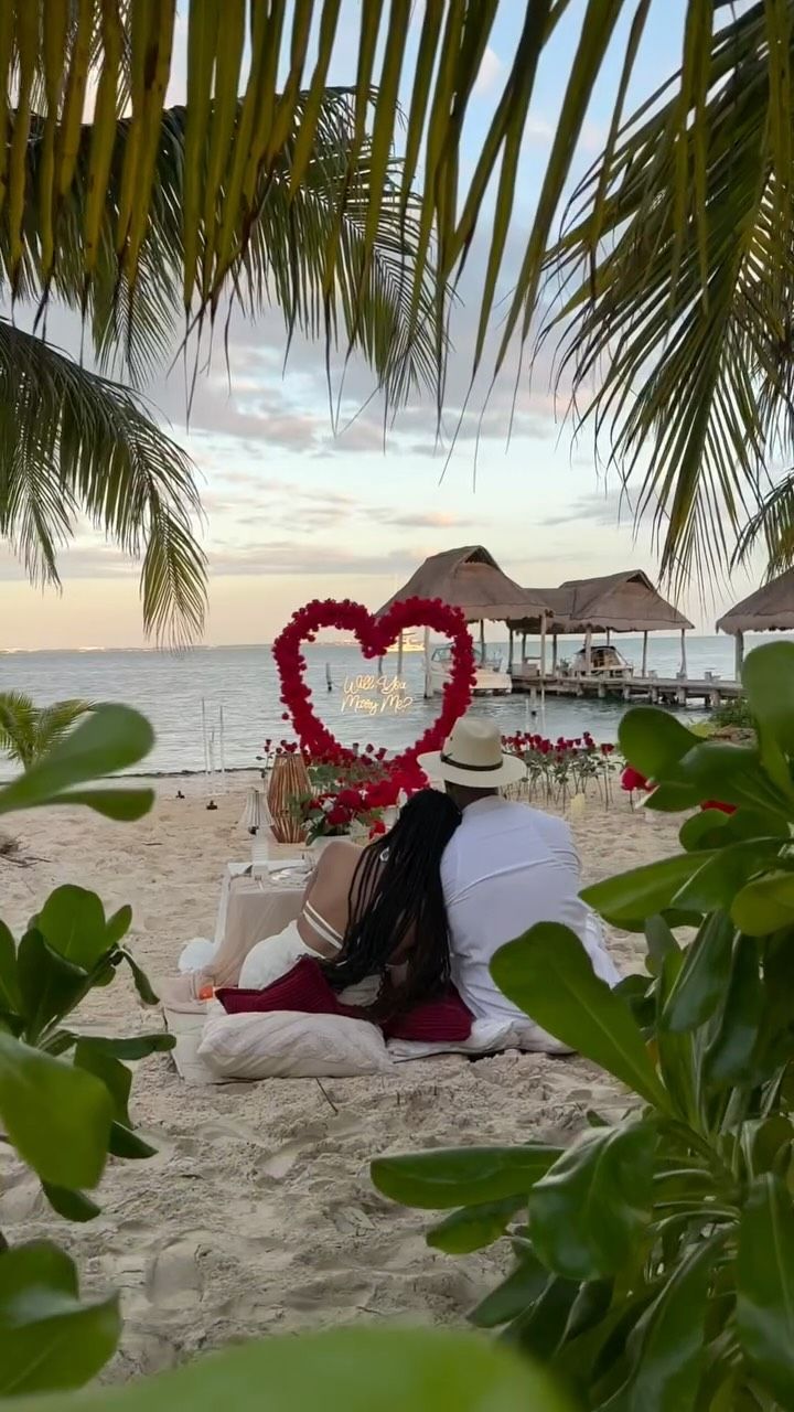 A beach sunset, a sweet little picnic, and the beginning of forever ✨💍