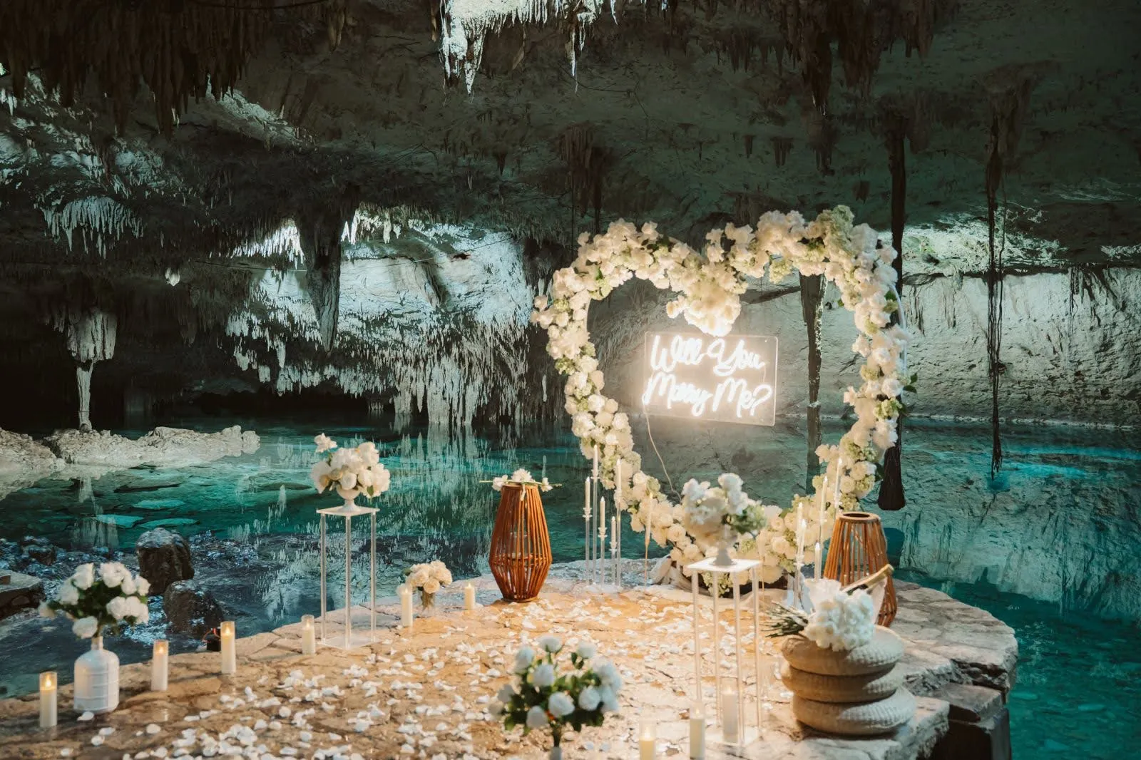 Private cenote proposal setup with flowers and candles in Riviera Maya