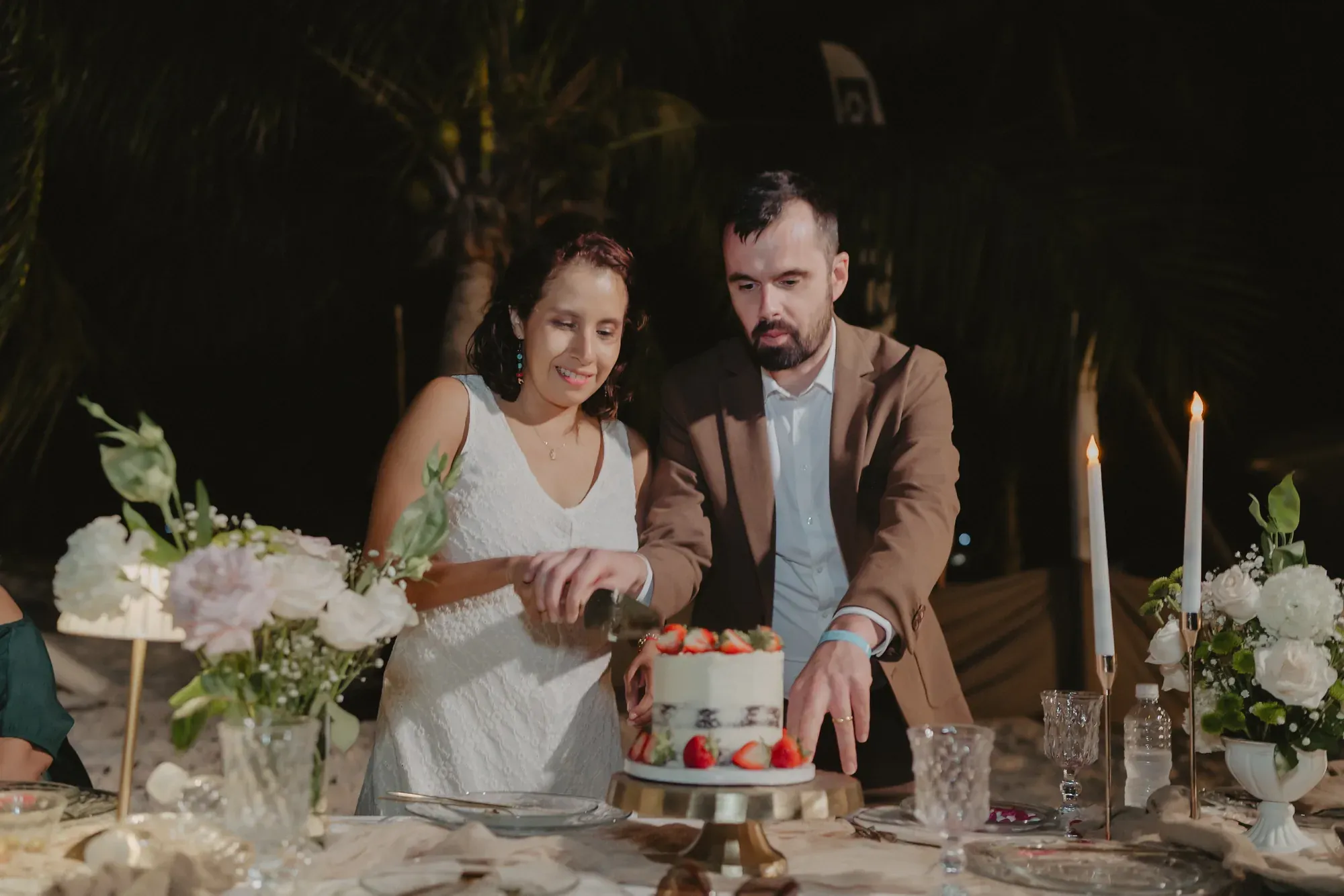 Couple cutting their wedding cake