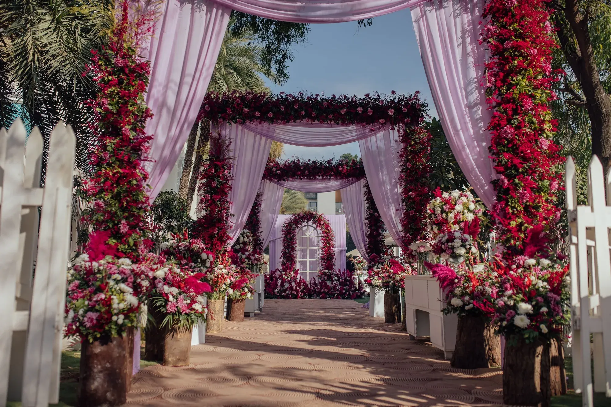 Wedding aisle covered in pink and red florals